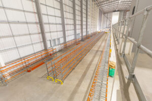 Low level pallet racking with mesh shelves